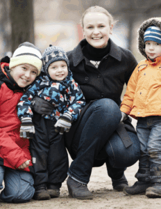 Mother and three children in winter gear