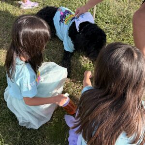 Children gather around a costumed dog during the Flashback 5K and Family Fun Festival at NWACC.